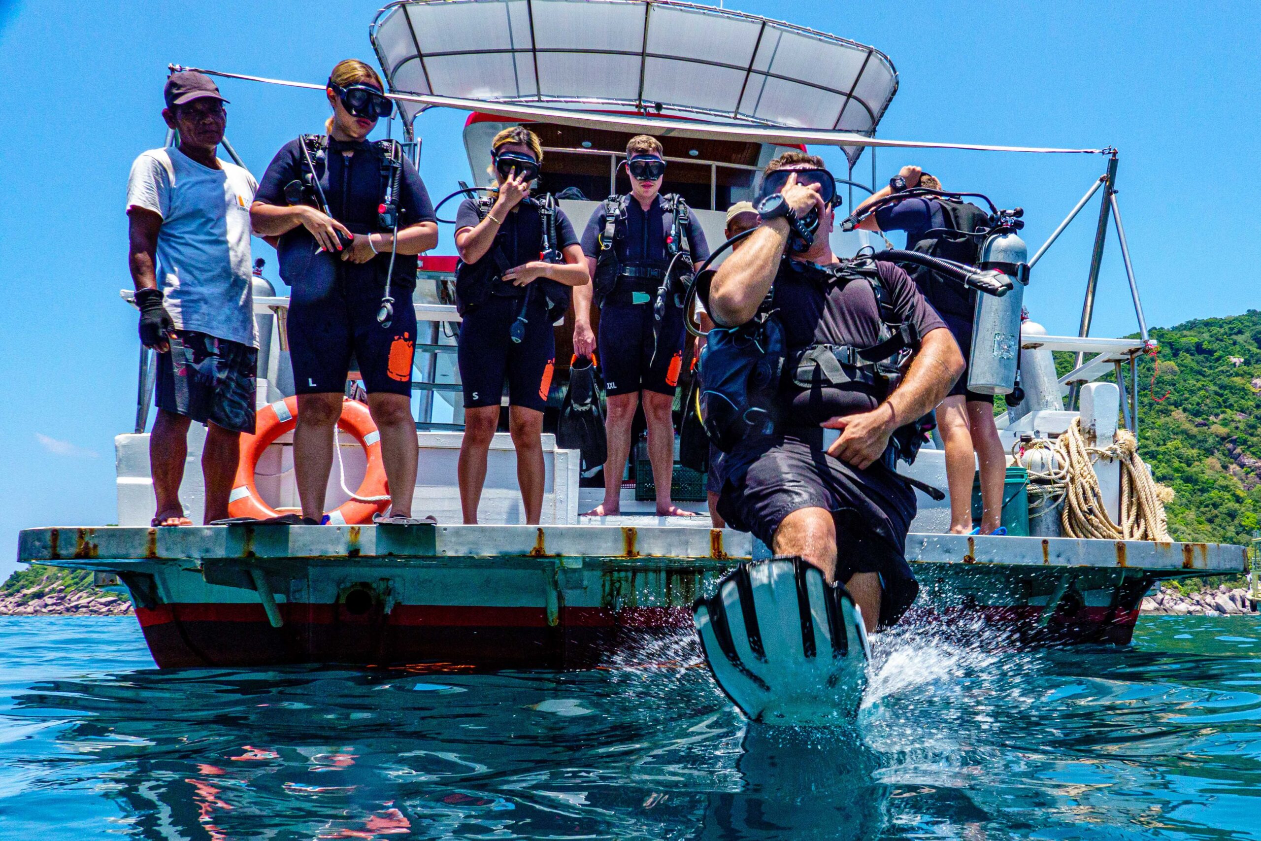 divers entering water