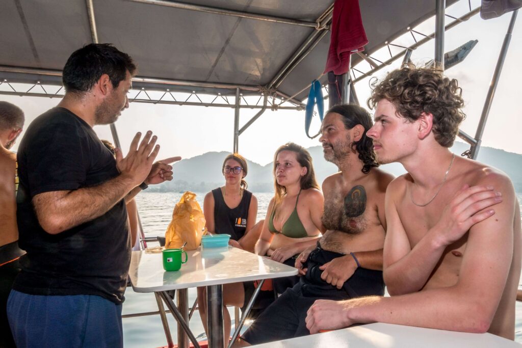 teaching scuba diving on a boat in koh tao