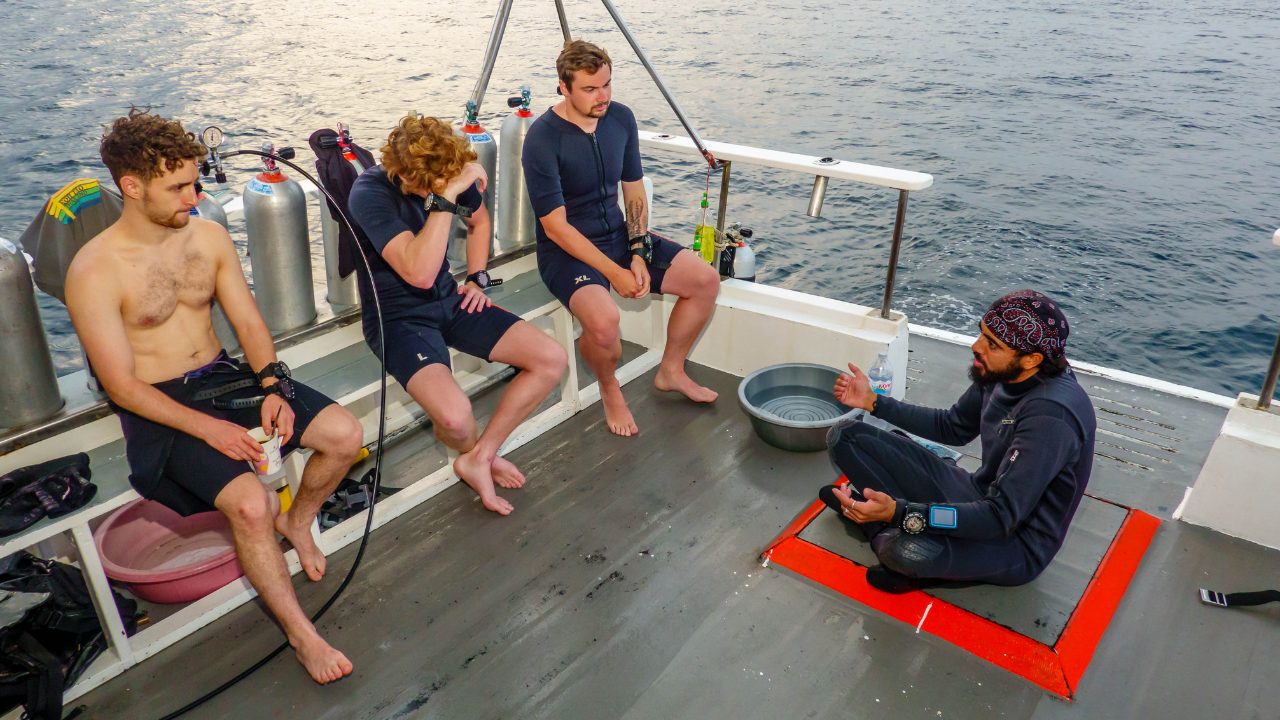Professional divemaster leading underwater expedition