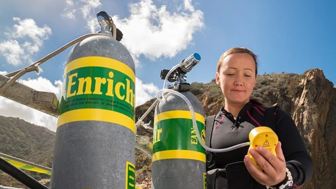 Divemaster analyzing nitrox gas mixture before professional dive