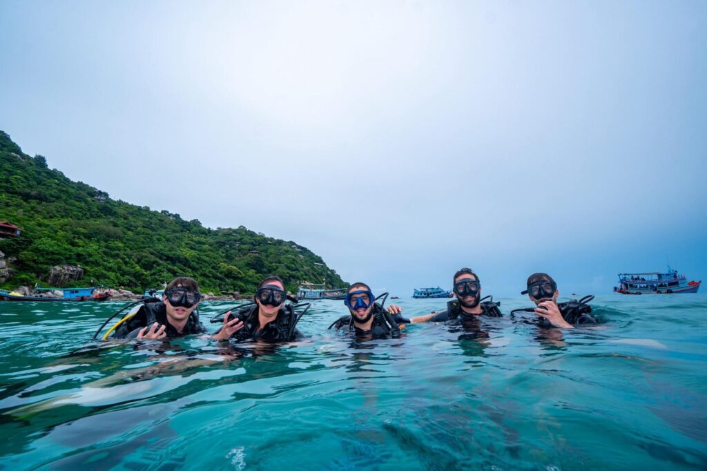 open water divers on the surface