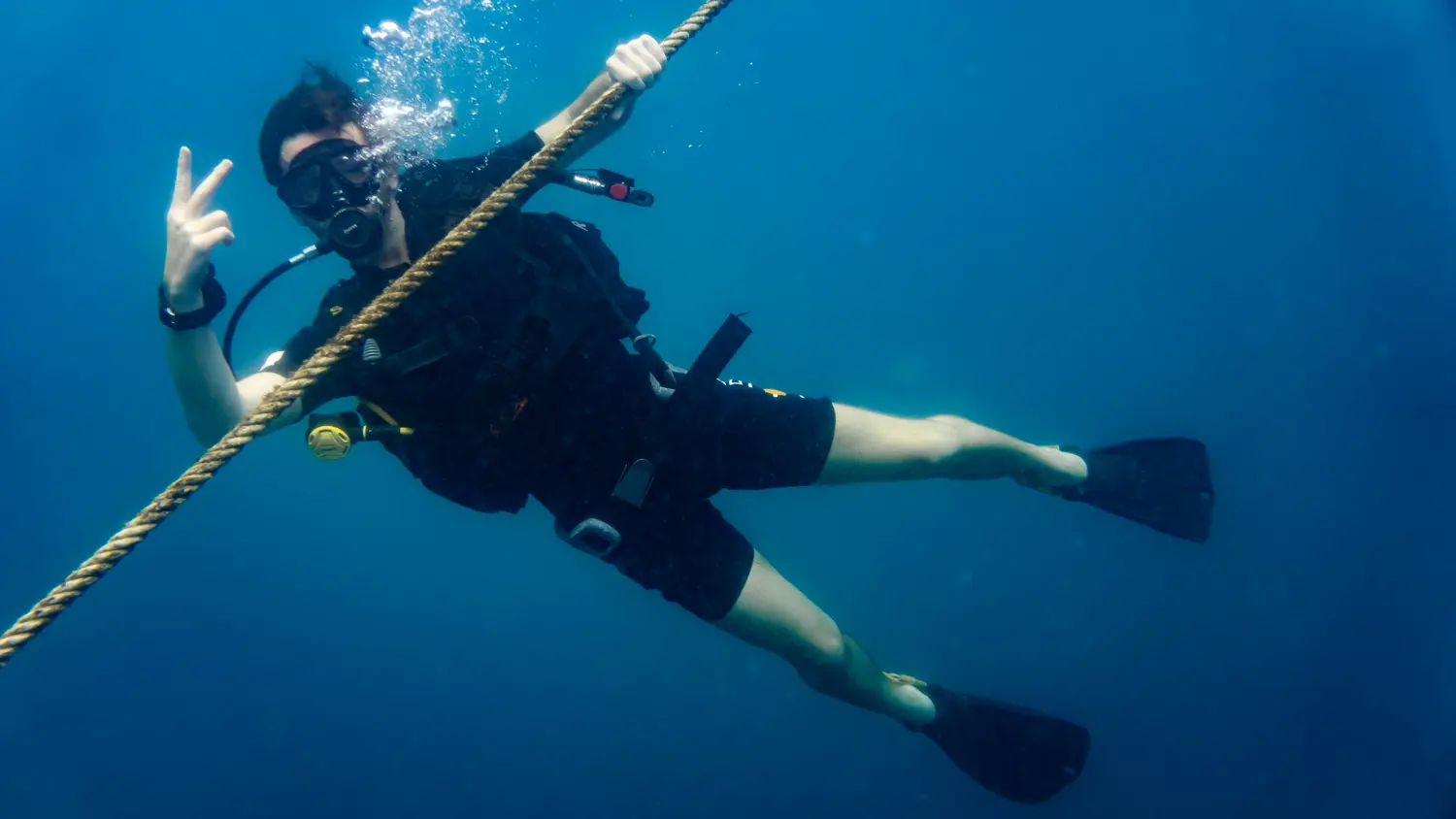 Beginner diving underwater in Koh Tao