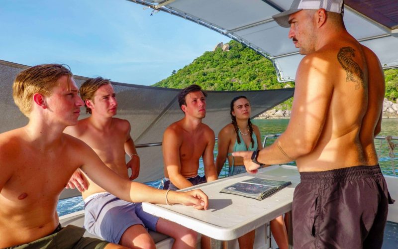 divemaster briefing on a dive boat koh tao