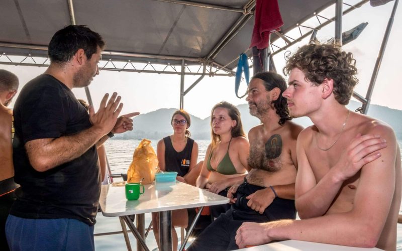 teaching scuba diving on a boat in koh tao